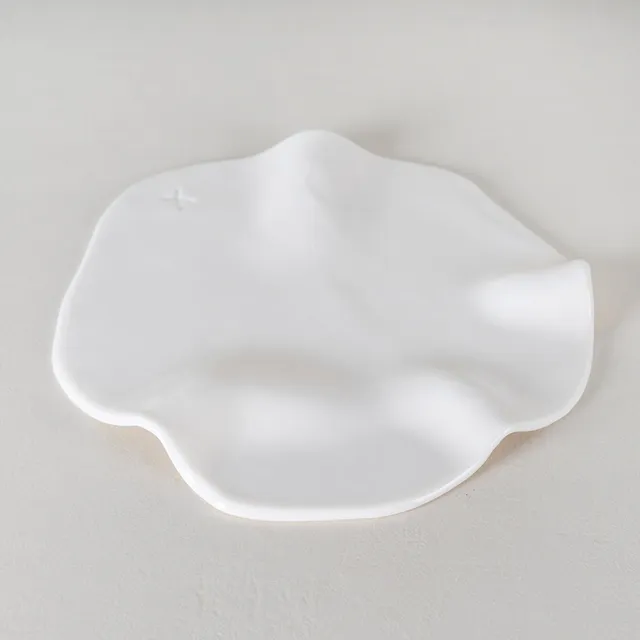Atelier Alida Ceramiche Nuvolì lastra porcellana sinuosa